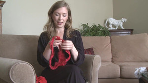 Charming mom puts on red lingerie and shows her hot body