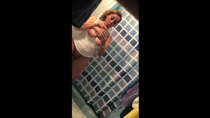 Gorgeous Latina MILF rubbing her pussy in the bathroom