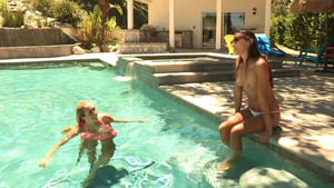 Two tantalizing babes swim naked in a pool before the fuck