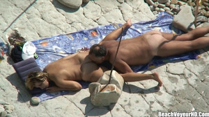 Blonde woman gets licked and fucked on the beach