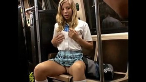 Blonde schoolgirl serves a Japanese man in a bus