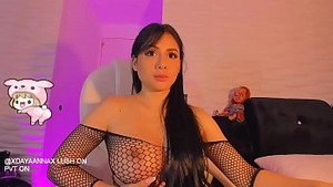 Busty latina shows her huge boobs through a fishnet outfit
