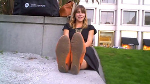 Long-haired mommy with wonderful tits puts her lovely pale soles up on display