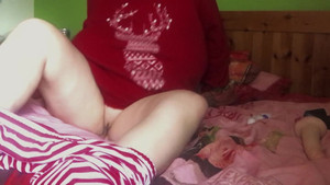 Thick horny mommy wearing Christmas sweater plays with her toys in both her holes