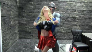 Gorgeous sexy blonde MILF in a Supergirl costume is defeated stripped and fucked