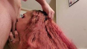 Pink-haired mature gets down on her knees to suck dick